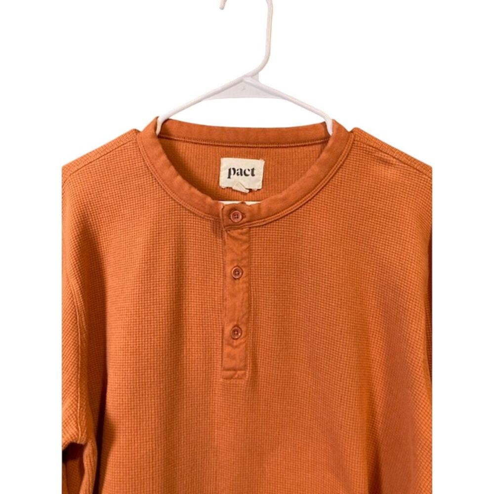Pact men's orange waffle knit long sleeve henley shirt.